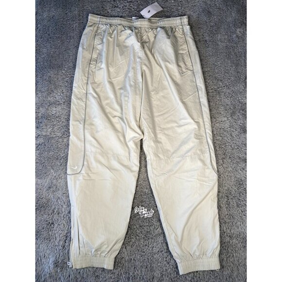 Nike Solo Swoosh Track Pants Size XL Men Light Bone White FB8620-072 - Picture 1 of 9
